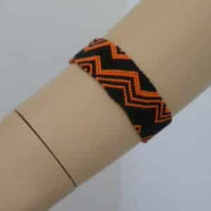 Bracelet tied ZIG ZAG black wide – color accent – Dark cadmium orange
